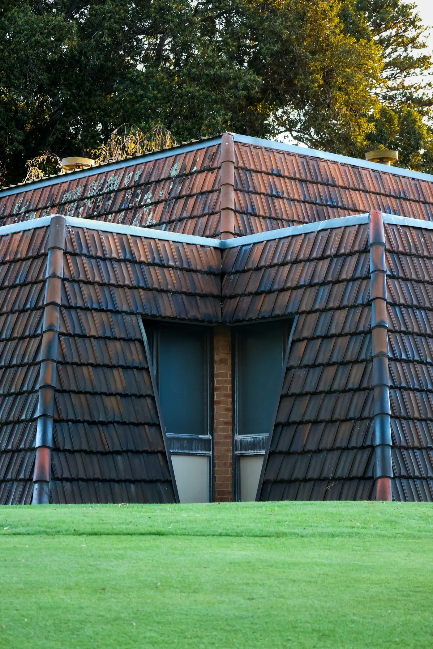 Stock architectural photograph showing tiled roof planes and windows at Kings Park
